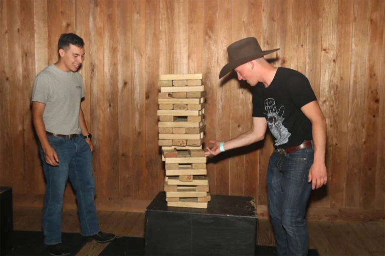 Build blocks and topple laughter at Stampede Houston's patio with our Giant Jenga! A fun and thrilling activity to enjoy in Houston's vibrant nightlife scene.